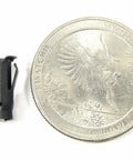 Bulletproof Black Tubular Barrel Nuts For Locking Down Emblems And Exterior Trim Panels Compatible With 7/32 Inch Holes And 3/16 Stud Sizes Includes 25 Auto Fasteners next to a coin for size comparison.