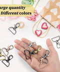 25 Heavy Duty Metal Swivel Clasp Hooks And One Inch D Ring Keychain Making Kit Featuring smooth lobster claw clasps in hand.