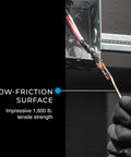Stainless Steel Fish Tape 240 Feet With Formed Hook And Tuff-Grip Pro Case shown routing wires, highlighting low-friction surface.