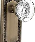Egg And Dart Plate With Round Crystal Door Knob For Interior Doors, Vintage Brass Hardware Set, side view with floral detail.