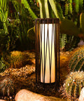 Outdoor Solar Floor Lamp With Rattan Trim And Steel Frame, Waterproof Patio Lantern in garden at nighttime