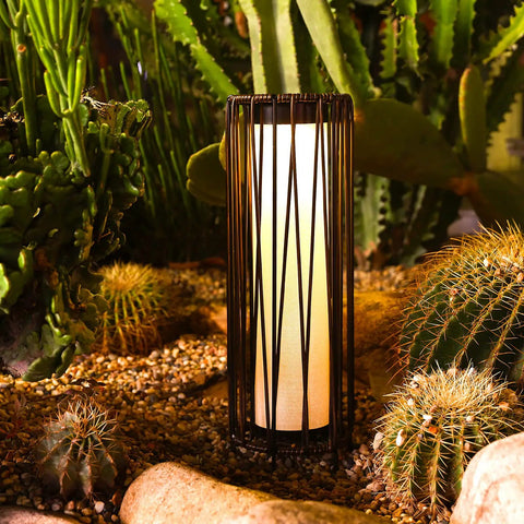 Outdoor Solar Floor Lamp With Rattan Trim And Steel Frame, Waterproof Patio Lantern in garden at nighttime