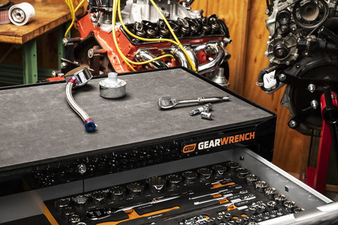 Beefy 83 Piece SAE And Metric Mechanics Tool Set with various tools on workbench in garage setting