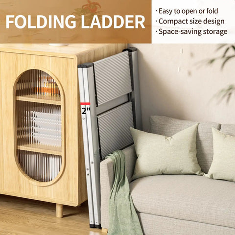 Two Step Folding Ladder With Anti Slip Wide Pedals, Grab And Go Portable Lightweight Stepladder next to a cabinet and sofa