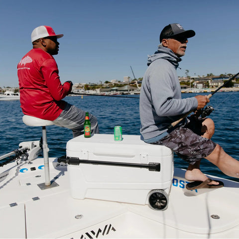 Fishing on a boat with MaxCold Glide 110 Qt Insulated Rolling Cooler with soft ride wheels and telescoping handle.