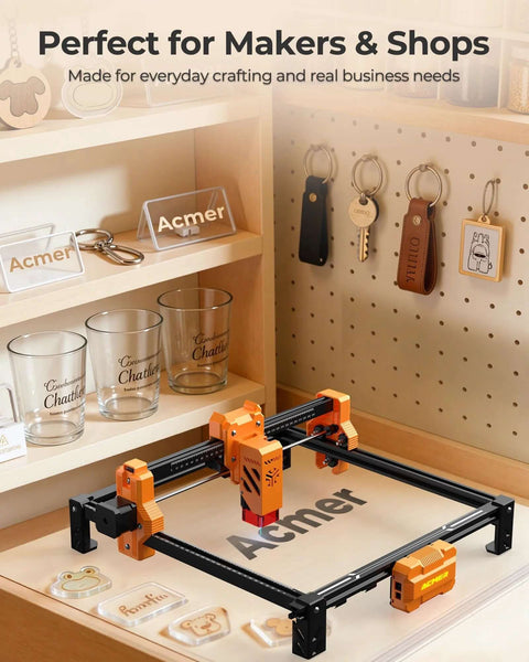 ACMER laser engraving machine front view, orange and black desktop unit with 300x300mm engraving area