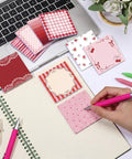 Person writing on Nine Pack Aesthetic Sticky Notes Set Cute Pastel Self Stick Notepads For Quick Notes And Easy Post Desk Organization Home Office Decor School Supplies Gift For Women Coworkers Red next to laptop
