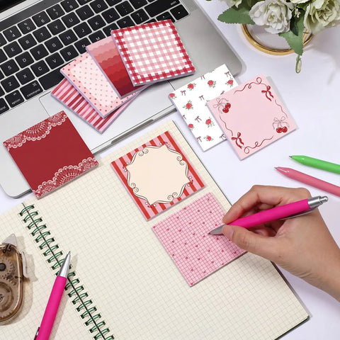 Person writing on Nine Pack Aesthetic Sticky Notes Set Cute Pastel Self Stick Notepads For Quick Notes And Easy Post Desk Organization Home Office Decor School Supplies Gift For Women Coworkers Red next to laptop