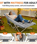Man relaxing on Portable Camping Cot With Thick Mattress, Extra Wide Design, Supports Up To 600 Lbs, Foldable, Gray