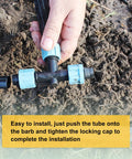 Hands installing 10 Pack Drip Irrigation Barbed Locking Fittings For 5/8 Inch (16mm) Tubing, 3 Way Tee Coupling on soil