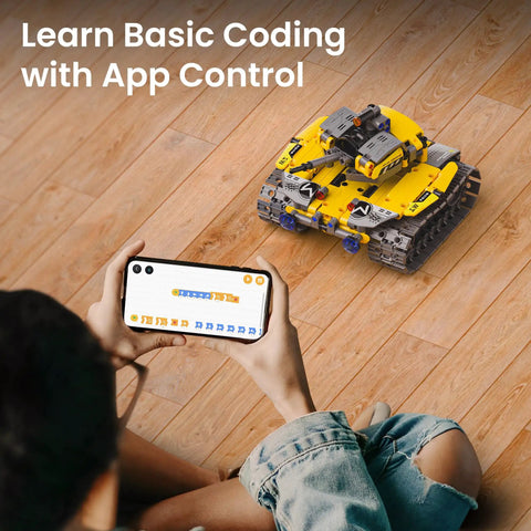 Child controlling yellow tank from 5 In 1 Buildable Robot Kit With Remote Control For Kids Ages 8 To 13, Awesome STEM Coding Toys