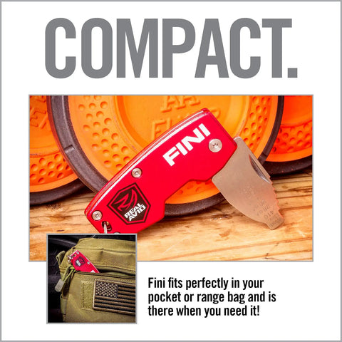 FINI Shotgun Tool Choke Wrench With Scope Turret Adjuster And Keychain on wooden surface next to clay targets.