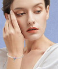 Woman wearing Birthstone Charm 925 Sterling Silver Pendant Dangle Beads Hot Air Balloon Necklace on bracelet.