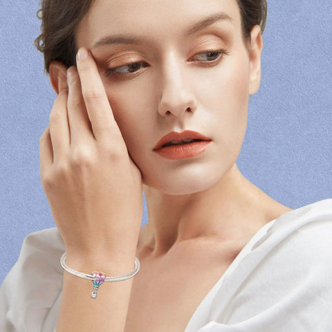 Woman wearing Birthstone Charm 925 Sterling Silver Pendant Dangle Beads Hot Air Balloon Necklace on bracelet.