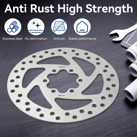140mm Stainless Disc Brake Rotor With 6 Bolt Mount For Bikes And Electric Scooters on dark surface with wrench