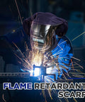 Welder wearing Two Pack Welding Helmet Cover And Bib Set With Press Fit Neck Seal, Flame Retardant Fabric, navy blue, sparks flying.