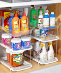 Total Game Changer Clear Three Tier Under Sink Organizer Two Pack with cleaning products in acrylic bins, adjustable design.