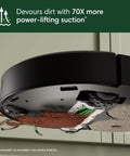 Underside view of Roomba Plus 405 Combo Robot Vacuum And Mop with Auto Wash Dock shows dirt devoured with spinning mop pads.