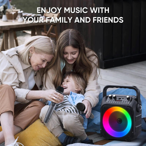 Family using Totally Party-Ready Portable Bluetooth Karaoke System With Two Wireless Mics, LED Lights; joyful outdoor moment