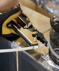 Person using HVAC Flex Duct Cable Tie Tensioning Tool With Auto Cut Off And Adjustable Tension Knob on ductwork