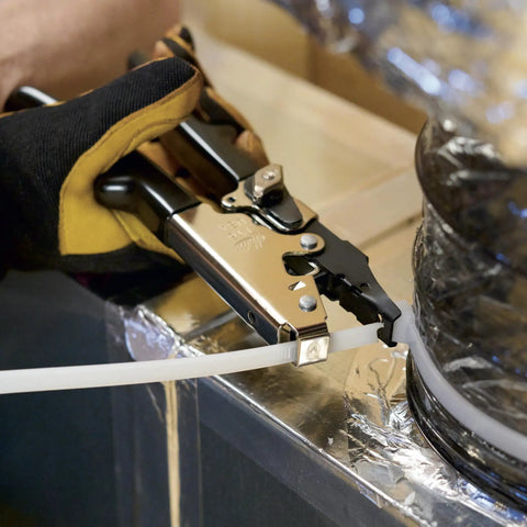 Person using HVAC Flex Duct Cable Tie Tensioning Tool With Auto Cut Off And Adjustable Tension Knob on ductwork