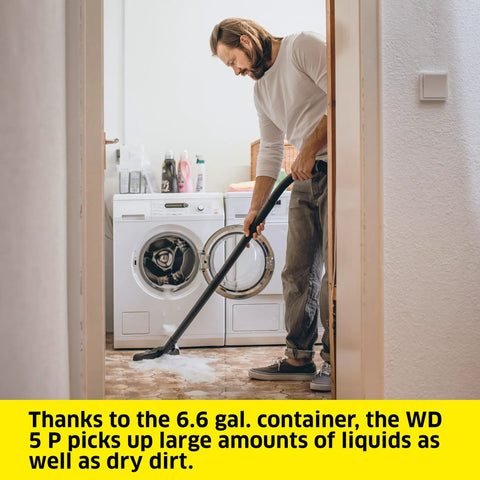 Man using WD 5 P Shop Vacuum 6.6 Gal Wet Dry Vacuum Cleaner With 33 Ft Reach on wet floor in laundry room