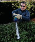 Person using 18V LXT Cordless Hedge Trimmer With 24 Inch Dual Action Blade Tool Only No Gas No Mess No Emissions Or Oil Mixing Ultra Quiet