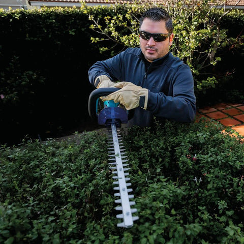 Person using 18V LXT Cordless Hedge Trimmer With 24 Inch Dual Action Blade Tool Only No Gas No Mess No Emissions Or Oil Mixing Ultra Quiet