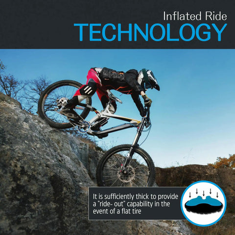 Mountain biker using Diamana HD Front And XHD Rear 27-Inch Tubeless Foam Tire Insert Set on rocky terrain, showcasing inflated ride technology.