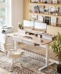 Fezibo 60 By 30 Inch Electric Standing Desk With Drawers Light Rustic Brown Finish in home office setting with dual monitors and a chair.