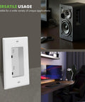Recessed Duplex Outlet Kit for wall mount next to AV gear and home office setup, 15A 125V 1 gang white finish, ideal for clean wall setups.