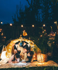 Family enjoying evening under Lit 50 Foot Outdoor LED String Lights With 27 Plastic G40 Bulbs And 2 Spare, IP65 Edison Globe