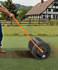 Heavy Duty Compost And Seed Spreader 24 Inch Wide Peat Moss Spreader with T Shaped Handle in use on grass