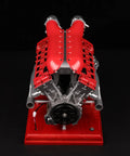 Front view of V12 Engine Model Kit With Over Eight Hundred Metal Parts Motorized Four Stroke Engine Electric Drive DIY STEM Build on red base