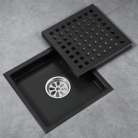 6 Inch Square Stainless Steel Shower Floor Drain With Removable Grate Anti Clog Hair Catcher Heavy Duty Brushed Finish Bathroom Drain Cover in a bath setting.
