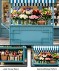 Hustle Ready Portable Mobile Vendor Cart with heavy duty awning and flowers displayed on golden wide countertop rack.
