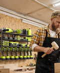 Heavy Duty Power Tool Wall Mount Organizer With 4 Tier Shelves And 8 Drill Holders installed in workshop with tools.