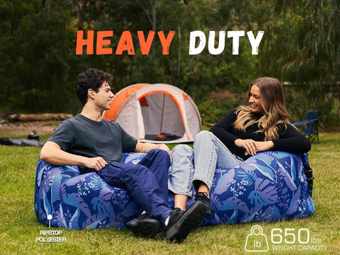 Two people lounging on a heavy duty Inflatable Couch Air Lounger Chair For Camping And Beach Trips, floral pattern, no pump needed.