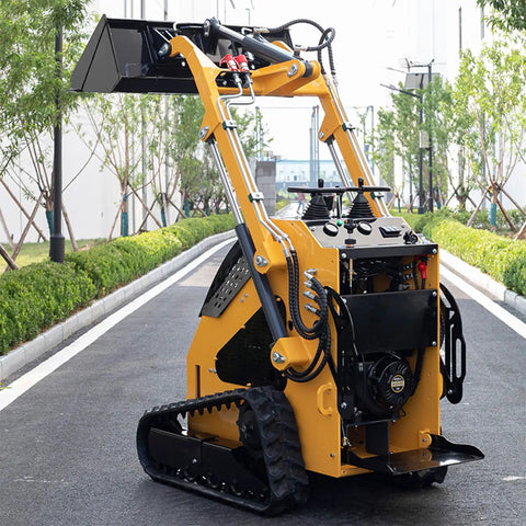 Stand On Wheeled Mini Skid Steer Loader With Dual Pilot Controls For Construction And Landscaping, shown on a road.