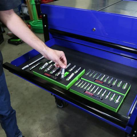 Person placing deep well socket set three eighths inch drive, twelve-piece metric socket set 8mm to 19mm in tool drawer