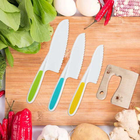 8-piece kids kitchen knife set on wooden board; white blades with green, blue and yellow handles