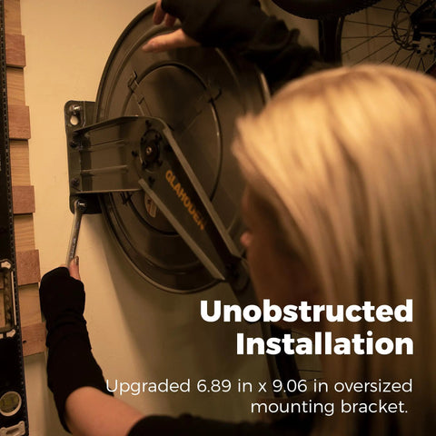 Heavy Duty Double Arm Retractable Air Hose Reel 50 Foot Reach Half Inch Steel Hybrid Core installed on wall with oversized bracket.