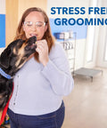 Woman using Pet Nail Grinder And Trimmer Kit Cordless And Rechargeable For Dogs Cats And Small Animals in stress-free grooming session.