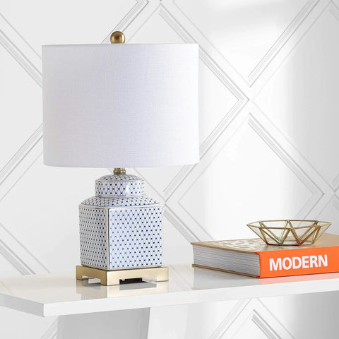 21.5 Inch White And Navy Ceramic Ginger Jar LED Table Lamp With Fishnet Chinoiserie Pattern on a modern shelf