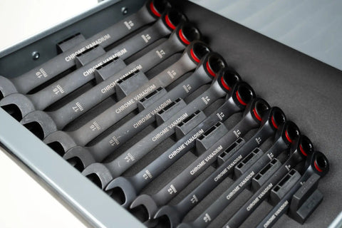 Basics Wrench Organizer Kit With 16 Rubber Holders For Tool Drawer, neatly holding chrome wrenches in a drawer setup.