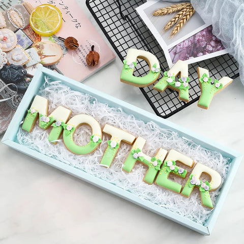 Alphabet Letter Cookie Cutter Set 26 Pcs Large 3 Inch Stainless Steel Bakeware For Fondant Biscuits Dough Molds For Birthday Parties Christmas Holidays And New Year Decorations shown with cookies spelling 'MOTHER' and 'DAY'