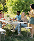 Group enjoying outdoor meal on Six Foot Picnic Table Set With Two Benches, Three Piece Folding Outdoor Table And Chair Set