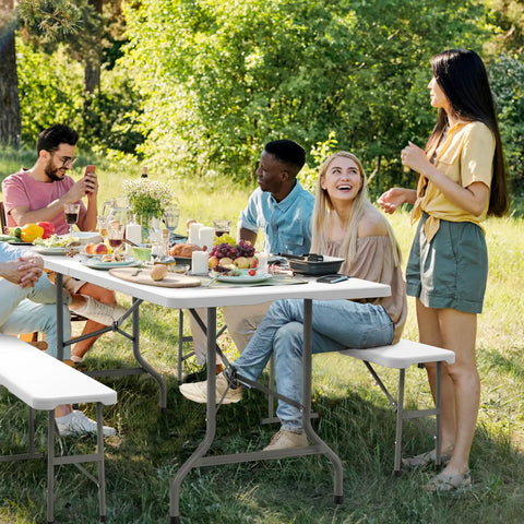 Group enjoying outdoor meal on Six Foot Picnic Table Set With Two Benches, Three Piece Folding Outdoor Table And Chair Set