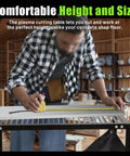 Man measuring on 32 Inch Plasma Cutting Table With 21 Inch Wide Slatted Top And 30 Inch Long Work Surface 250 Lb Capacity