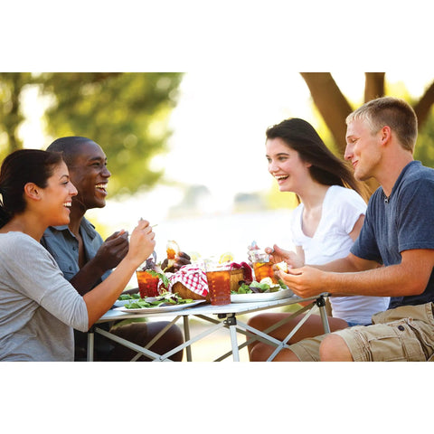 Outdoor Folding Table With Aluminum Slat Top And Snap Together Design Seats Four Carry Bag Included Perfect For Camping Tailgating Grilling Hunting Outdoor Dining And More being used by four people outdoors